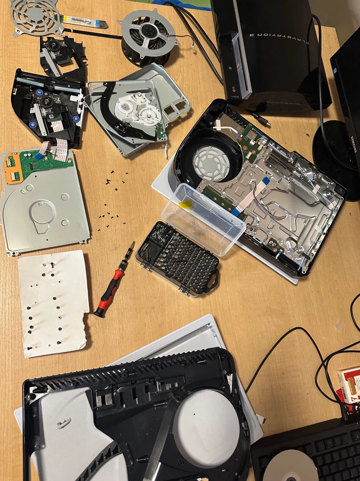 PlayStation 5 disassembled for repair on the FlexRepairs bench