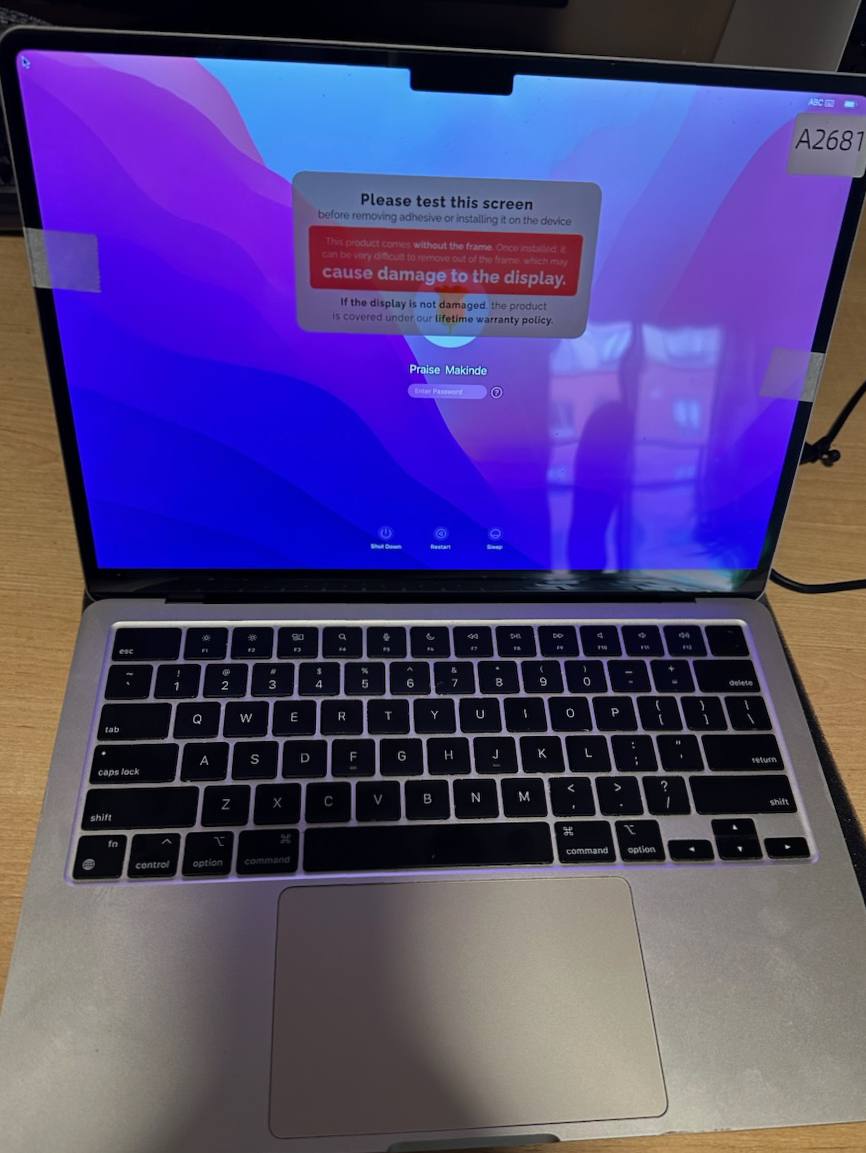 MacBook replacement screen displaying a clear working image during testing